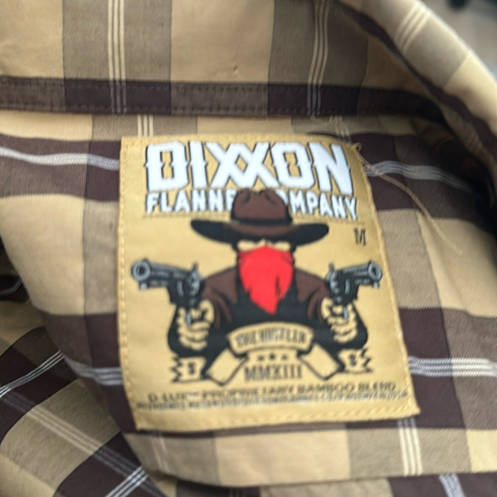 Woman’s medium Dixxon buttoned shirt.
